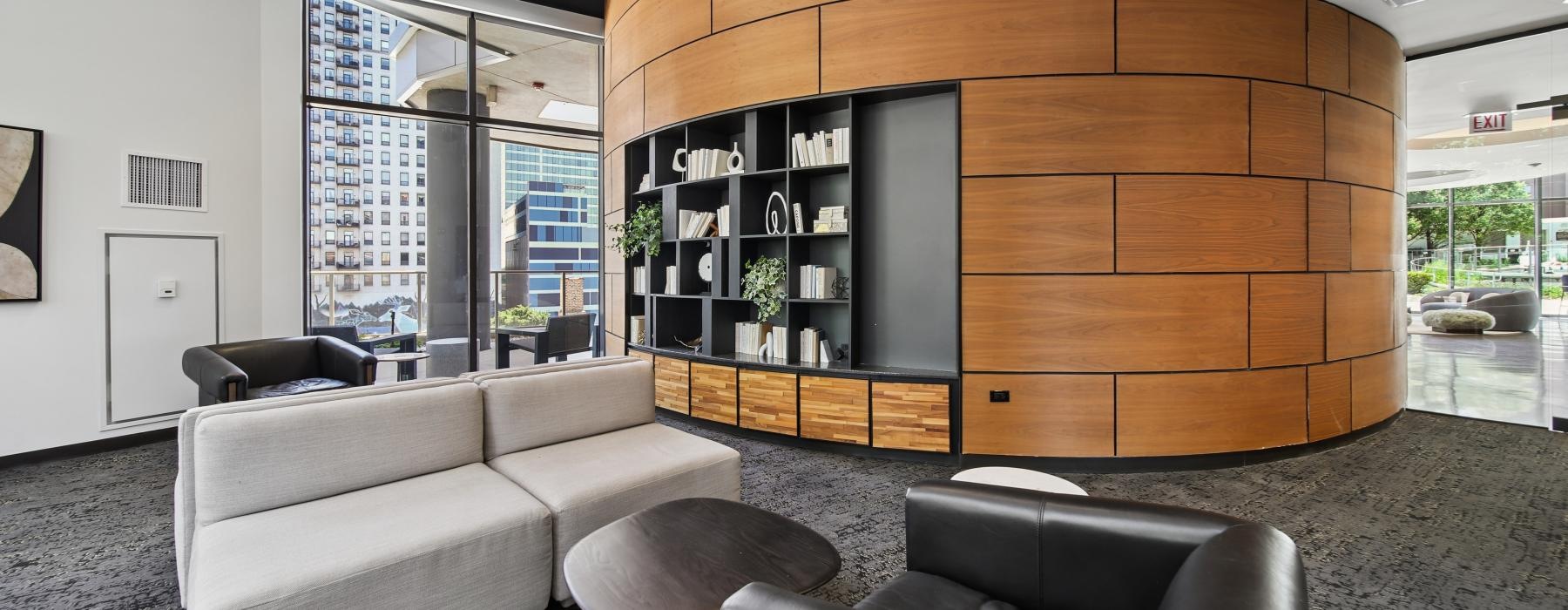 a room with a couch and chairs