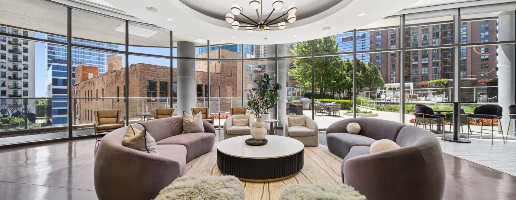a large room with a large glass wall and a large round table